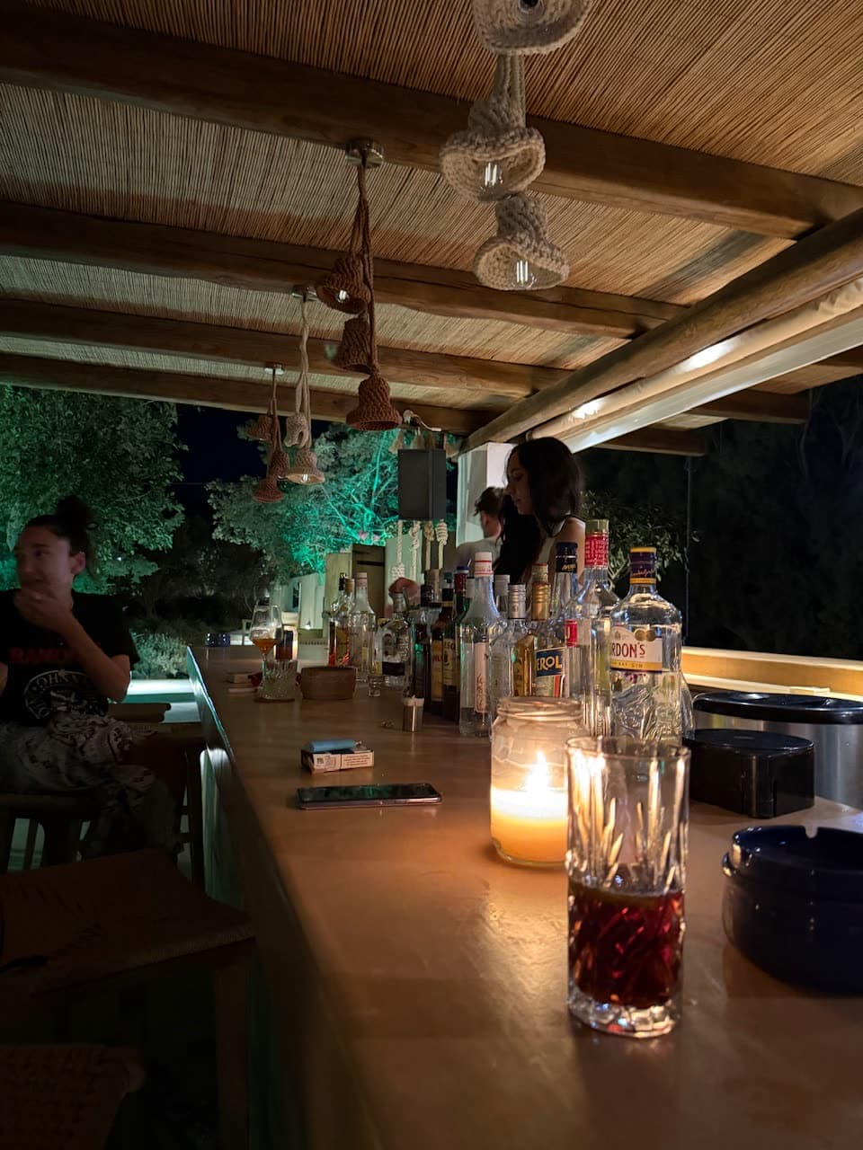 Cocktails at candlelit outdoor bar